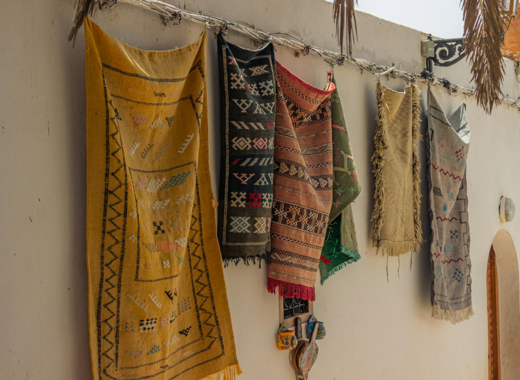 vibrant traditional rugs hanging outdoors
